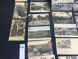 several old black and white photographs of people and buildings on a table