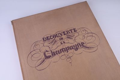 a brown book with writing on it sitting on a table