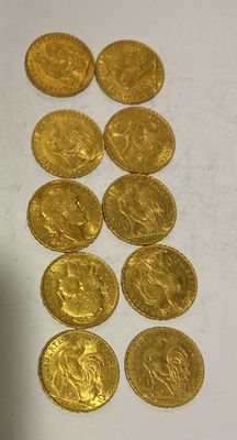 a lot of gold coins sitting on a table