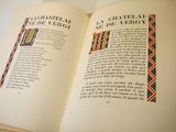 an open book with a picture of a cross on it
