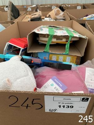 a cardboard box filled with assorted items in a warehouse