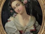 painting of a woman with flowers in her hair in a gold frame