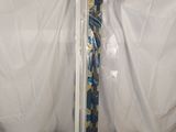 a tie that is wrapped in plastic on a white surface