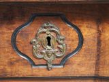 a close up of a wooden door with a keyhole