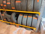 a lot of tires on the shelves in the store