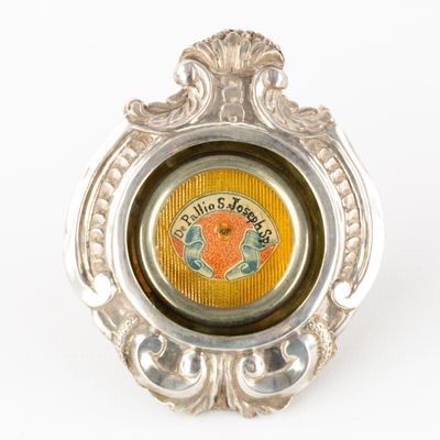 a silver ring with a picture of a fish inside of it