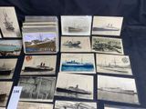 some old postcards of ships and boats are on a table