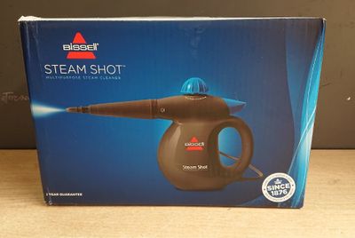 La boîte du « Steam Shot » est ouverte sur la table.