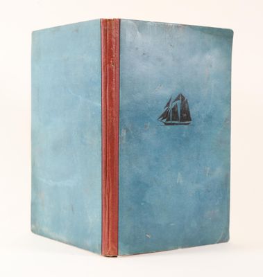 a blue book with a picture of a sailboat on it