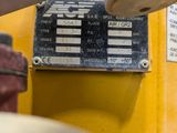 a close up of a sign on the side of a yellow machine
