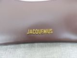 a close up of a brown purse with a name on it