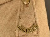 a close up of a pair of shoes with a name on it