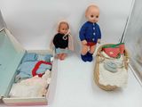two dolls that are sitting next to each other