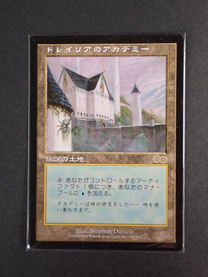 a close up of a card with a castle in the background