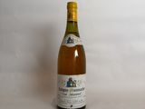 a bottle of wine that is sitting on a table