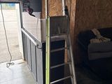 a ladder leaning against a wall in a garage