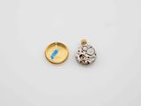 two gold and diamond pendants, one of which is shaped like an elephant and the other of which is
