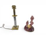 a small lamp that is next to a candle holder