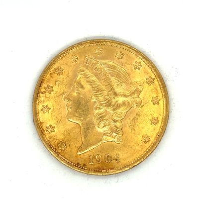 l'image d'une pièce d'or sur laquelle figure une tête de femme