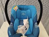 a baby car seat that is sitting on a table