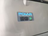 a close up of a refrigerator with a polar sticker on it