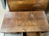 a wooden table with a drawer underneath it