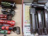 a box with many different types of toy trains in it