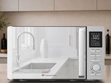 a microwave that is sitting on a counter in a kitchen