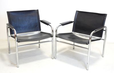 two black leather chairs sitting side by side on a white floor