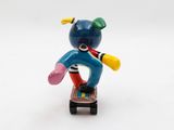 a small figurine of a person riding a skateboard