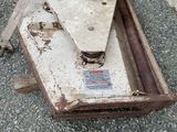 a piece of machinery that is sitting on the ground