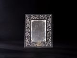 an image of a silver picture frame on a black background