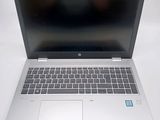 an open laptop computer sitting on top of a white table