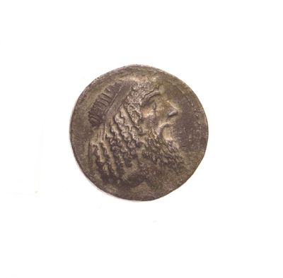 une pièce de monnaie sur laquelle est représentée la tête d'un lion