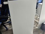 a picture of an office cubicle with chairs and desks