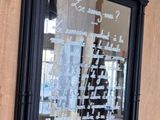 a mirror with writing on it hanging on the wall