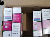 several boxes of organine are stacked on top of each other