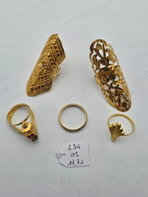 a group of gold rings and rings with a price tag