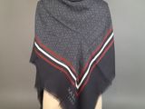 a black and grey scarf with red, white, and blue stripes