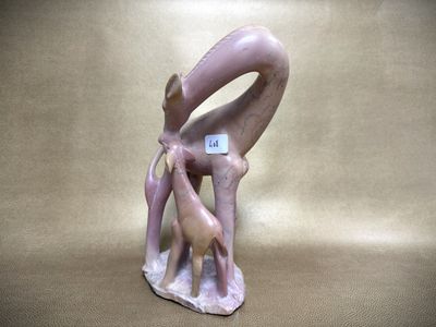 a figurine of a giraffe and a baby giraffe