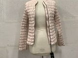 a close up of a mannequin mannequin with a jacket on it