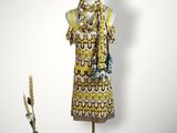 an image of a mannequin wearing a yellow dress and a black hat