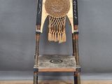 a wooden chair with a basketball net on it