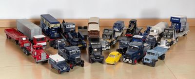a lot of toy trucks that are on the floor