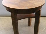 a small wooden table with a chair on it