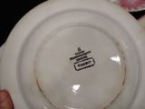 a person holding a plate that has a picture on it