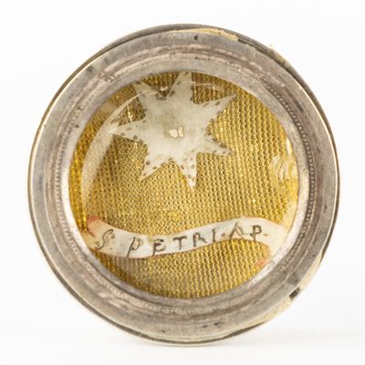 an image of a close up of a silver and gold locke with a star on it