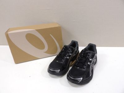 nike air max black and white sneakers with box on a table