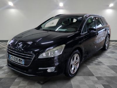 a picture of a black car that is parked in a garage