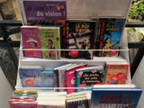 a lot of books that are on display in a case